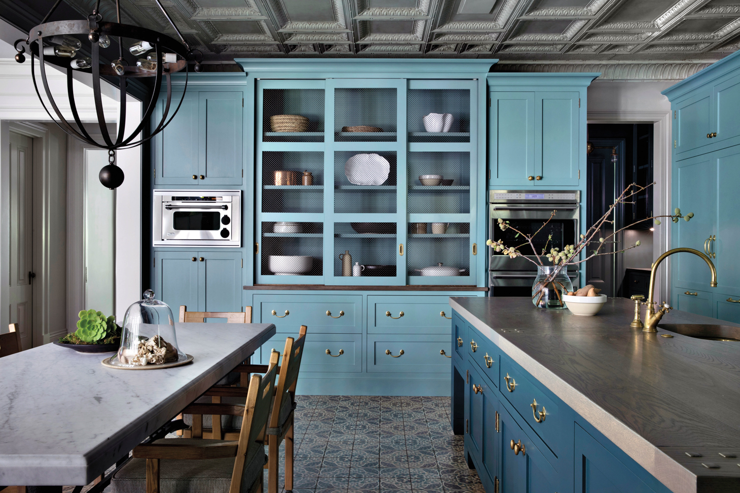 Kitchen with light blue cabinets...