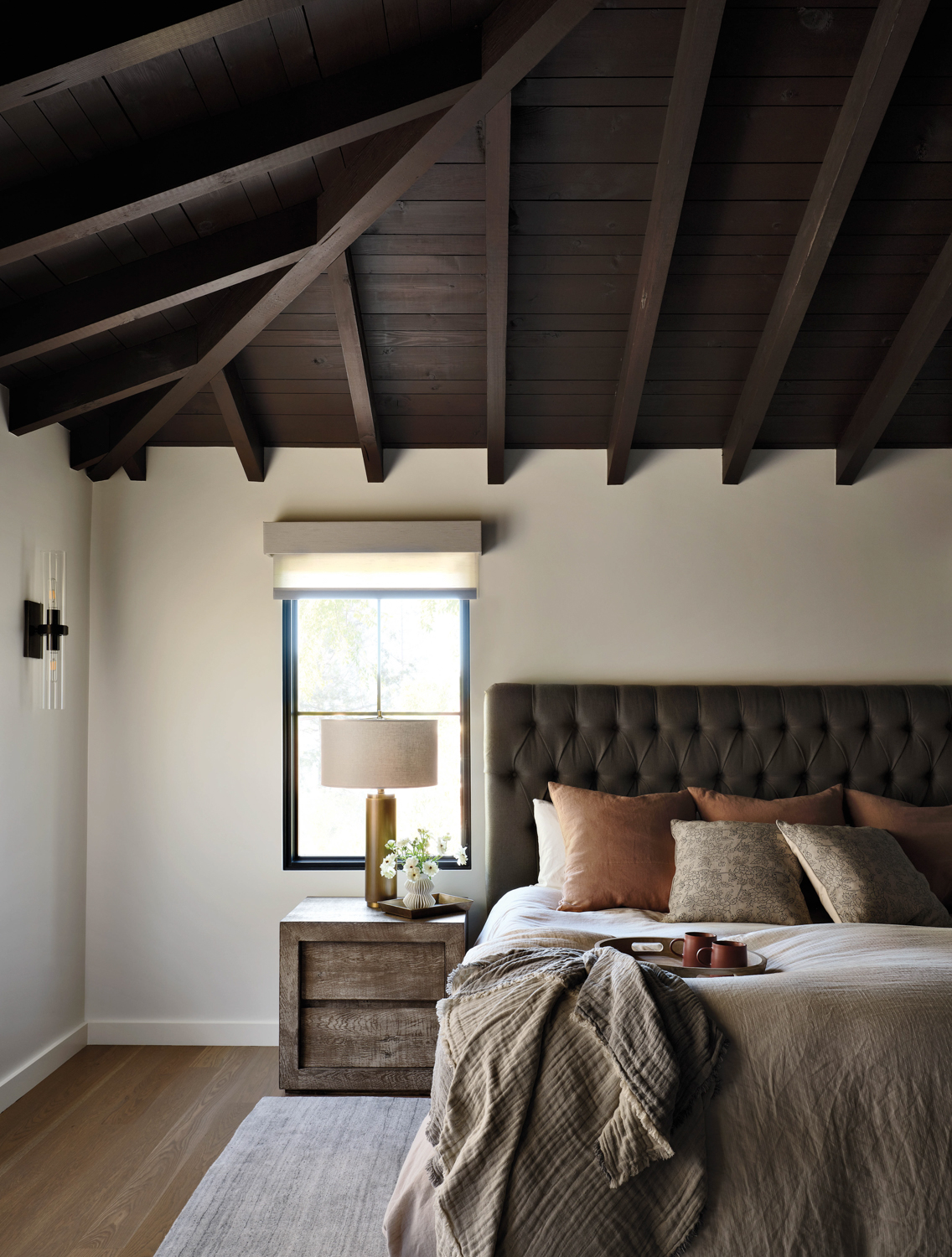 Bedroom with wood-paneled ceiling, bed...
