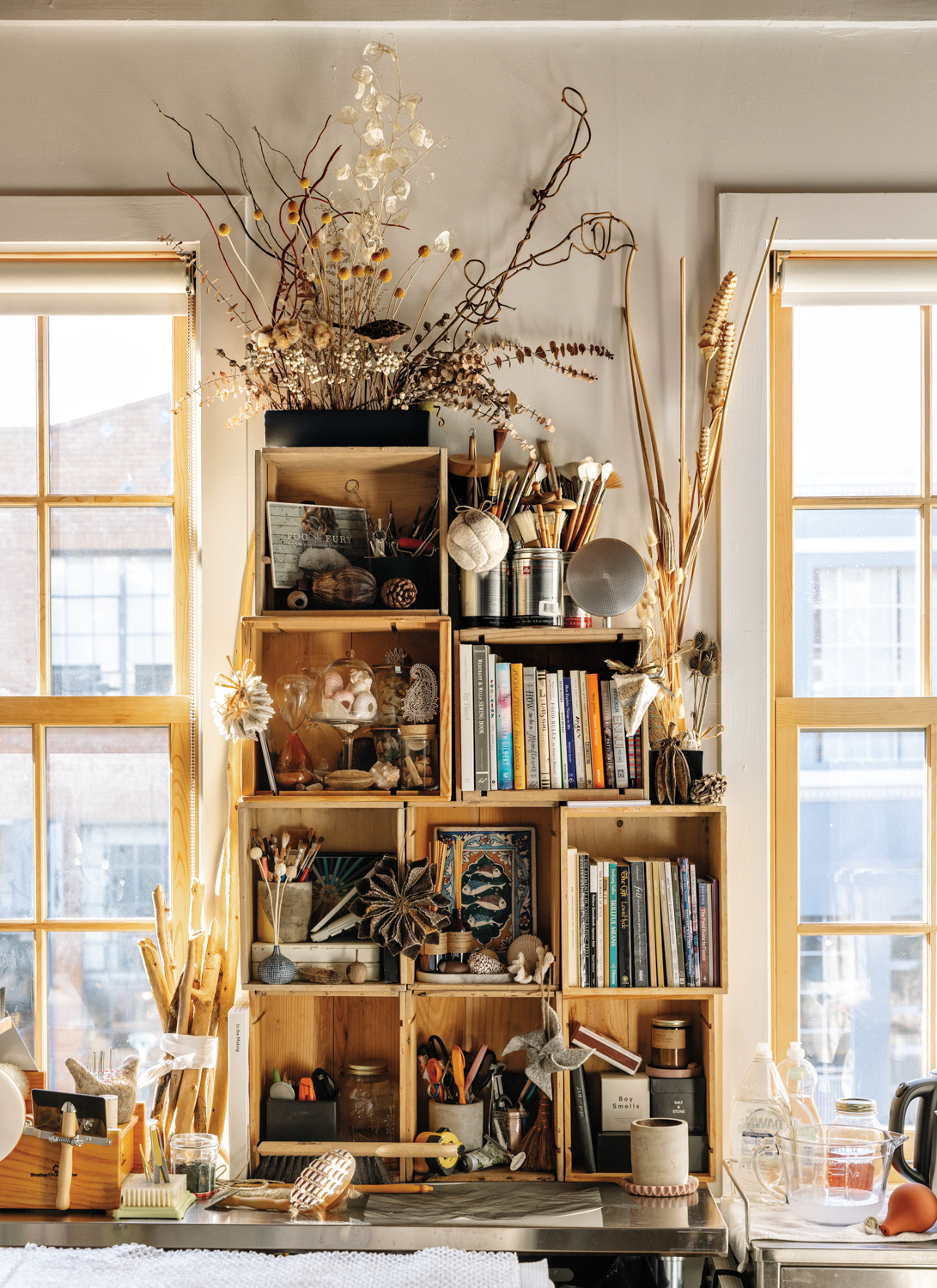 Kristin Kelly Colombano stocks her wooden shelves with books, plants and other accessories