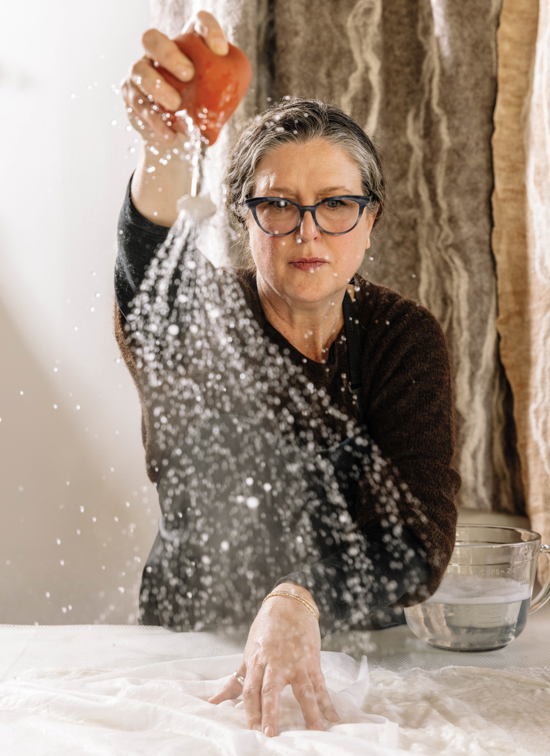 Kristin Kelly Colombano uses hot water to manipulate the fibers