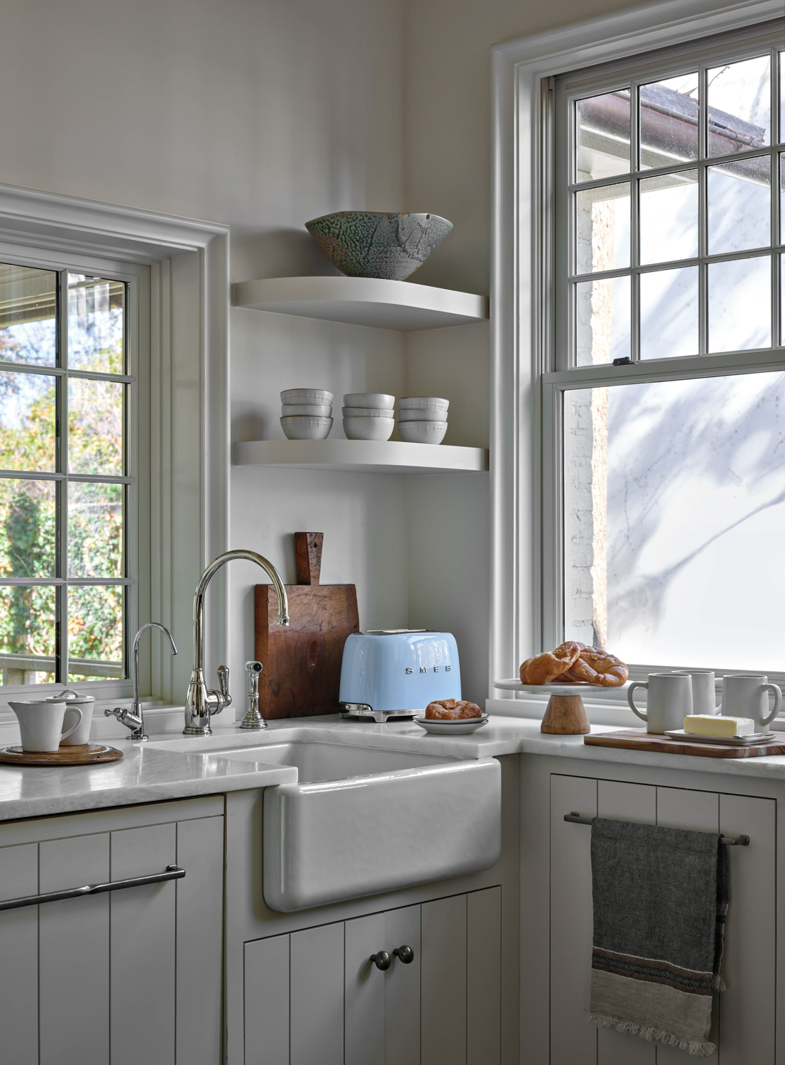 Scullery kitchen with open shelving,...