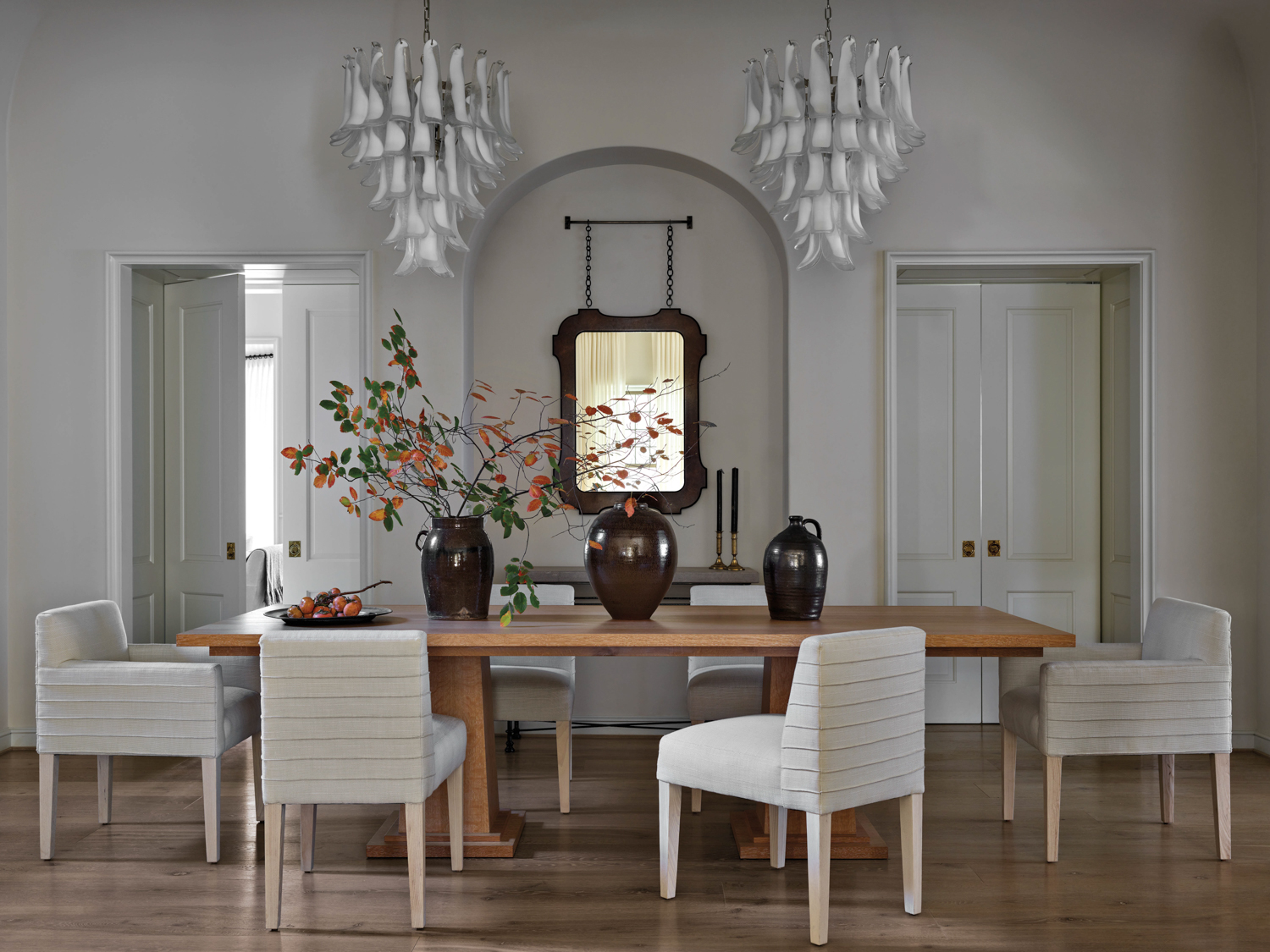 White dining room with wooden...