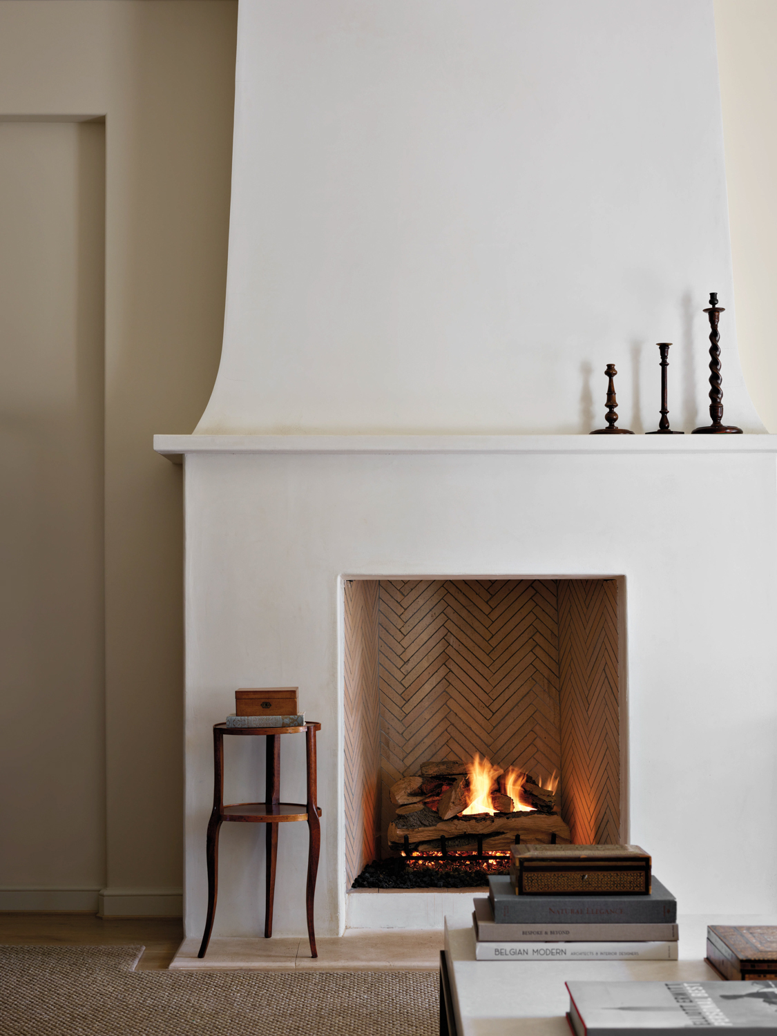 Plaster fireplace accented by a...