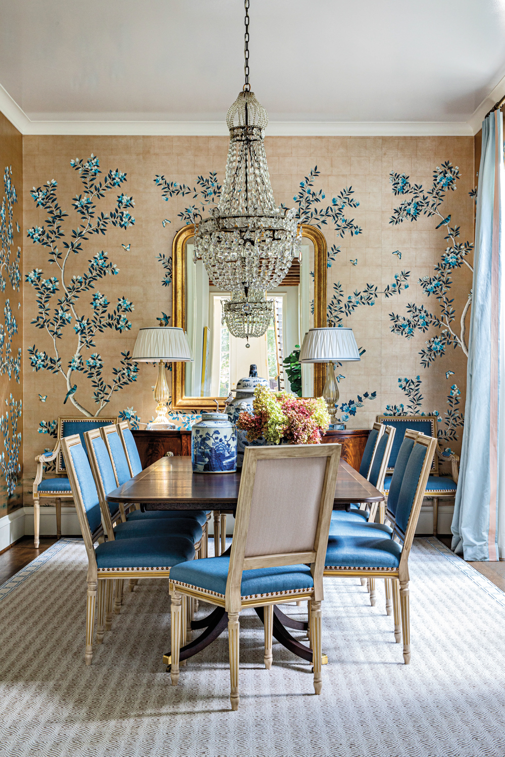 dining room featuring hand-painted wallpaper and traditional furnishings in home by Kristen Woolery