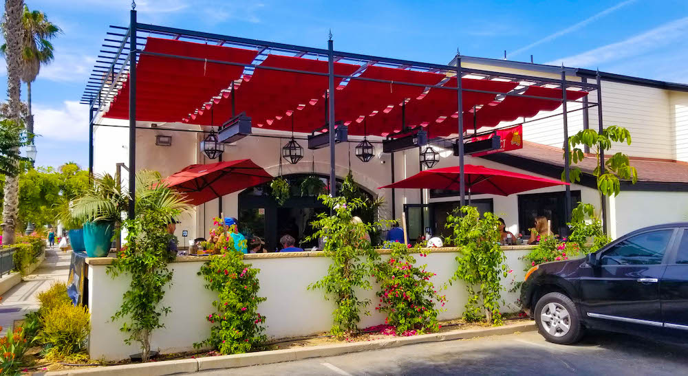 red awnings on a Santa Barbara restaurant with outside seating