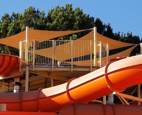 orange shade structure sail panel over magic mountain in California