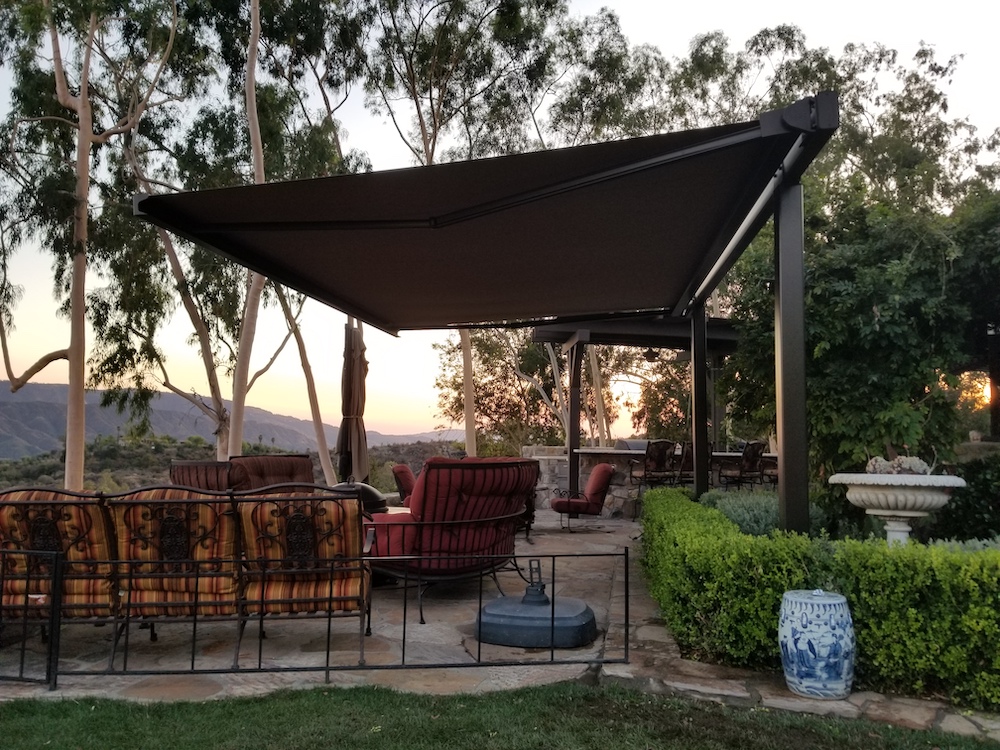 retractable shade structure overlooking vineyard in California
