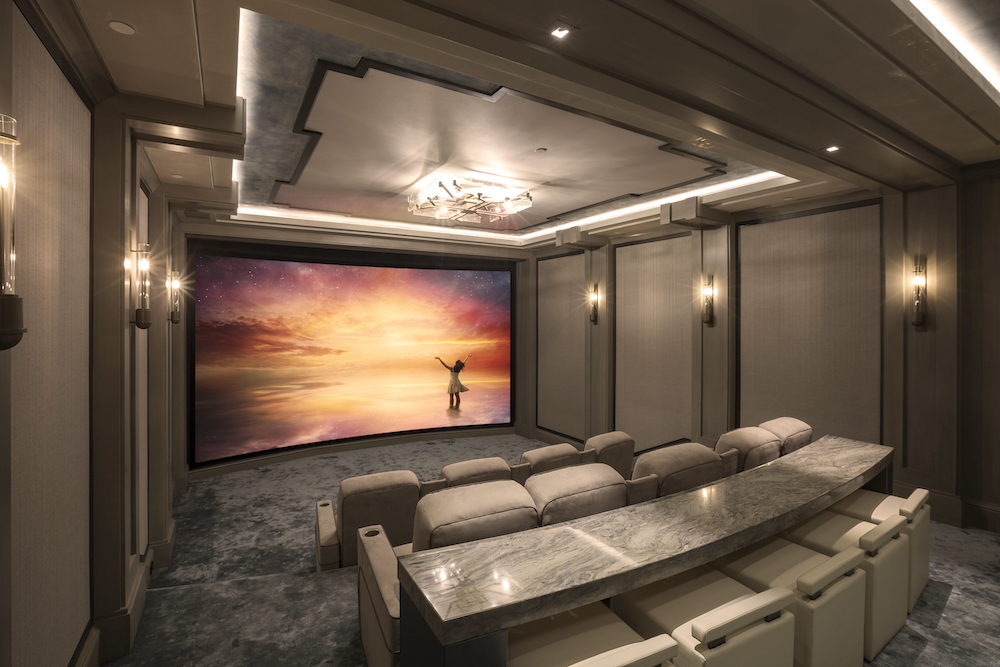 home theater with tan interior and furniture
