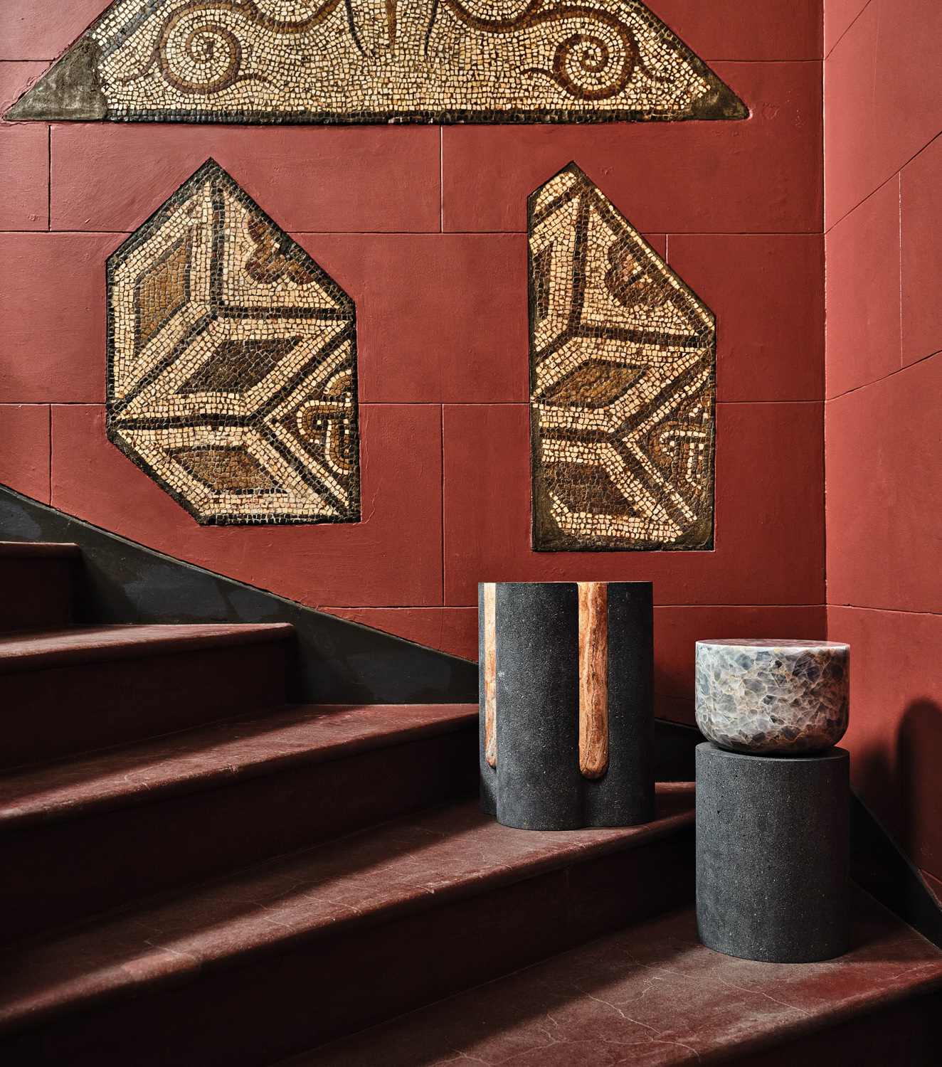 red staircase with pots and tile artwork
