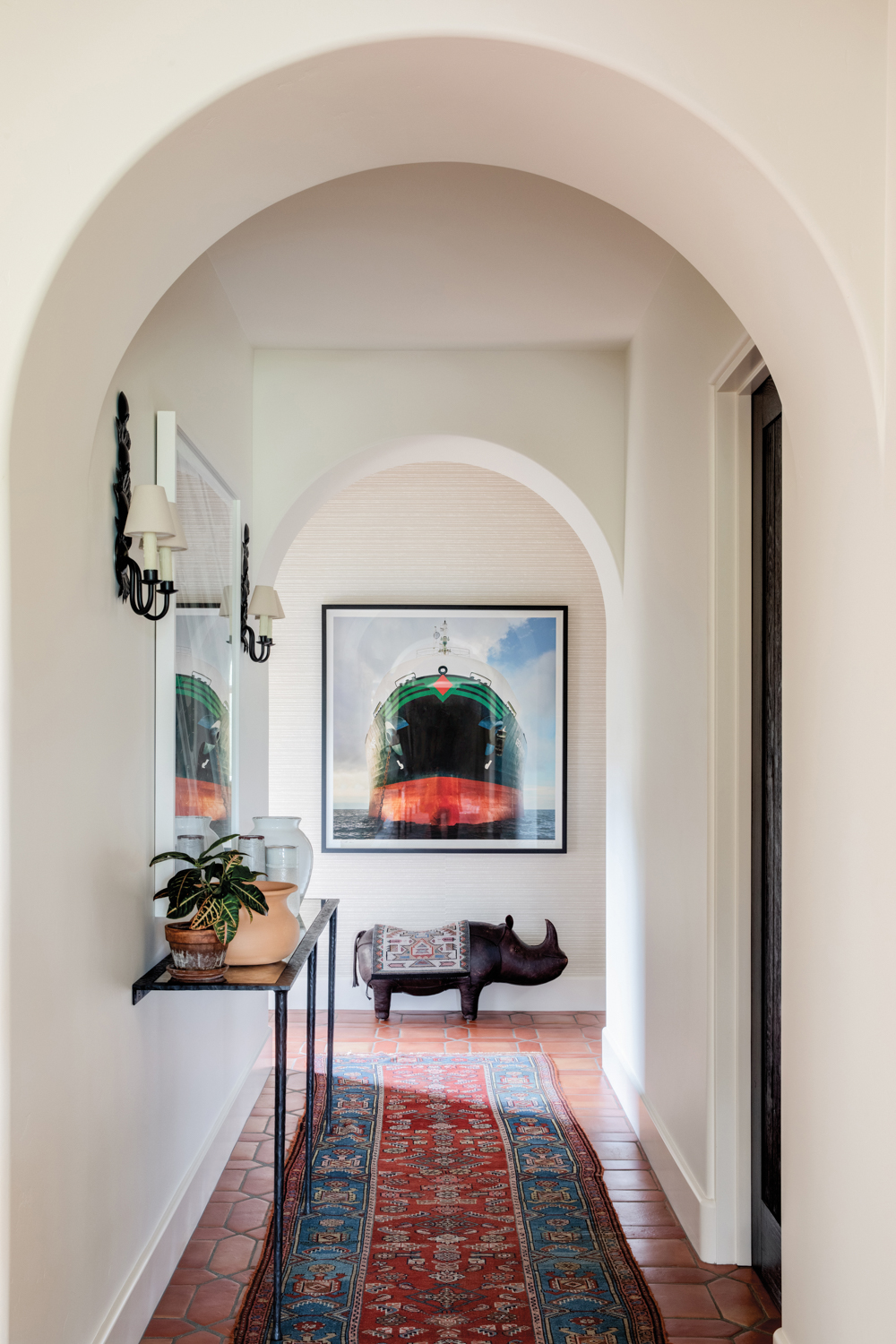 hallway with arched doorway and...