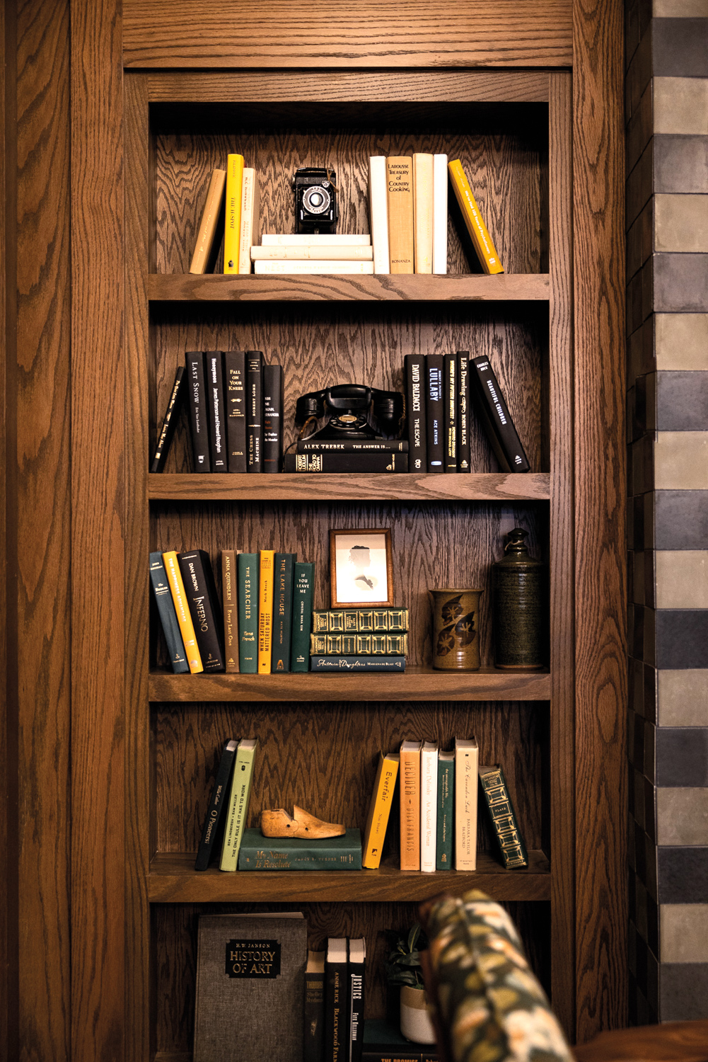 Close-up photo of a natural-wood book shelf