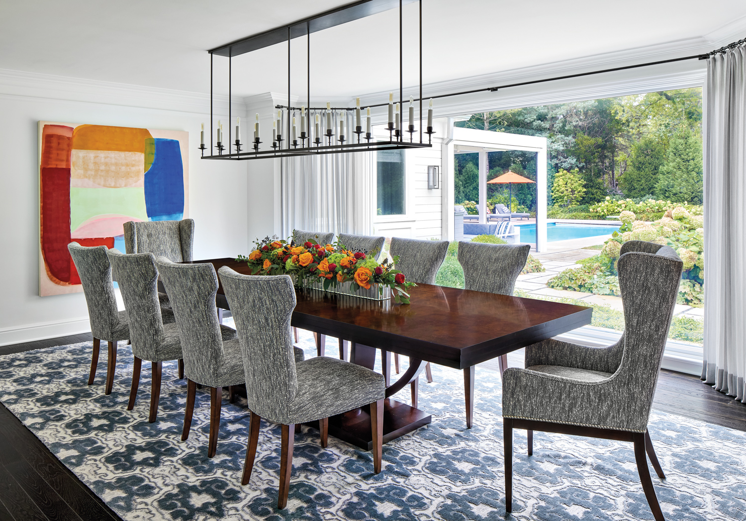 dining room with abstract painting,...