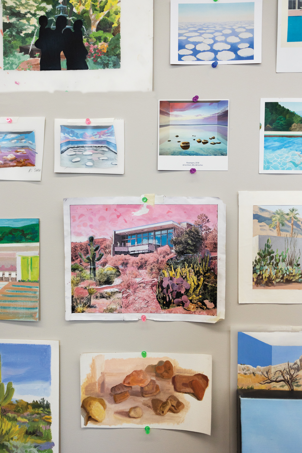 a grouping of watercolor studies hangin on a wall