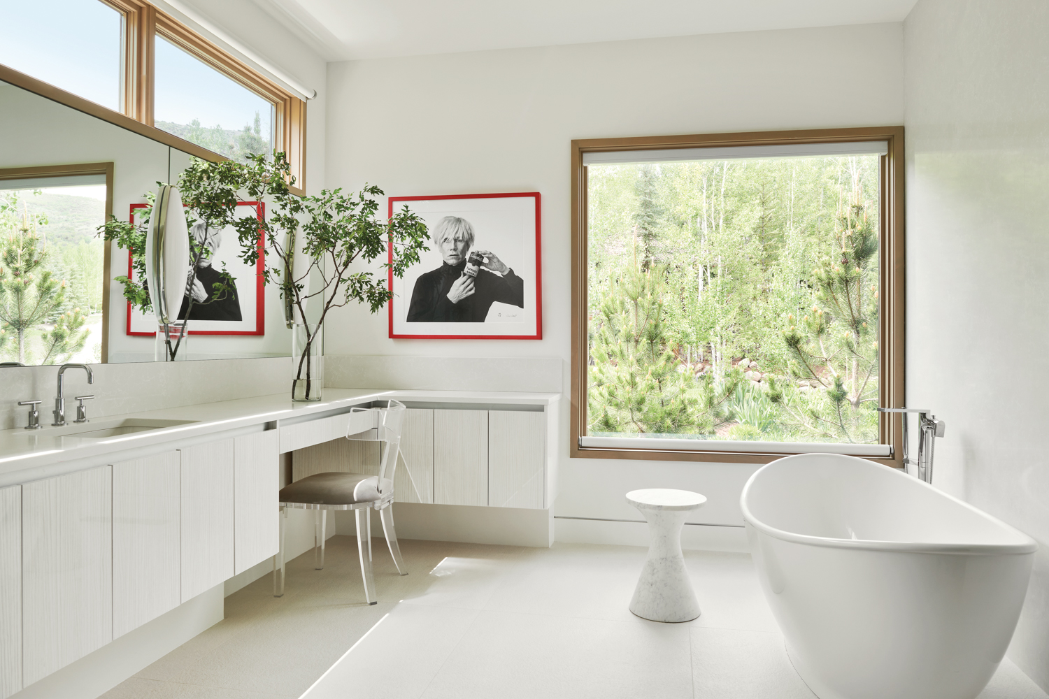 white bathroom with red framed...