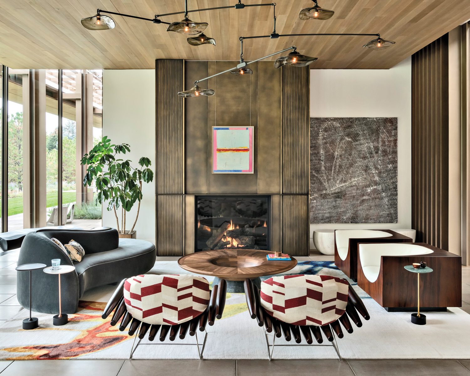 living room with bronze fireplace,...