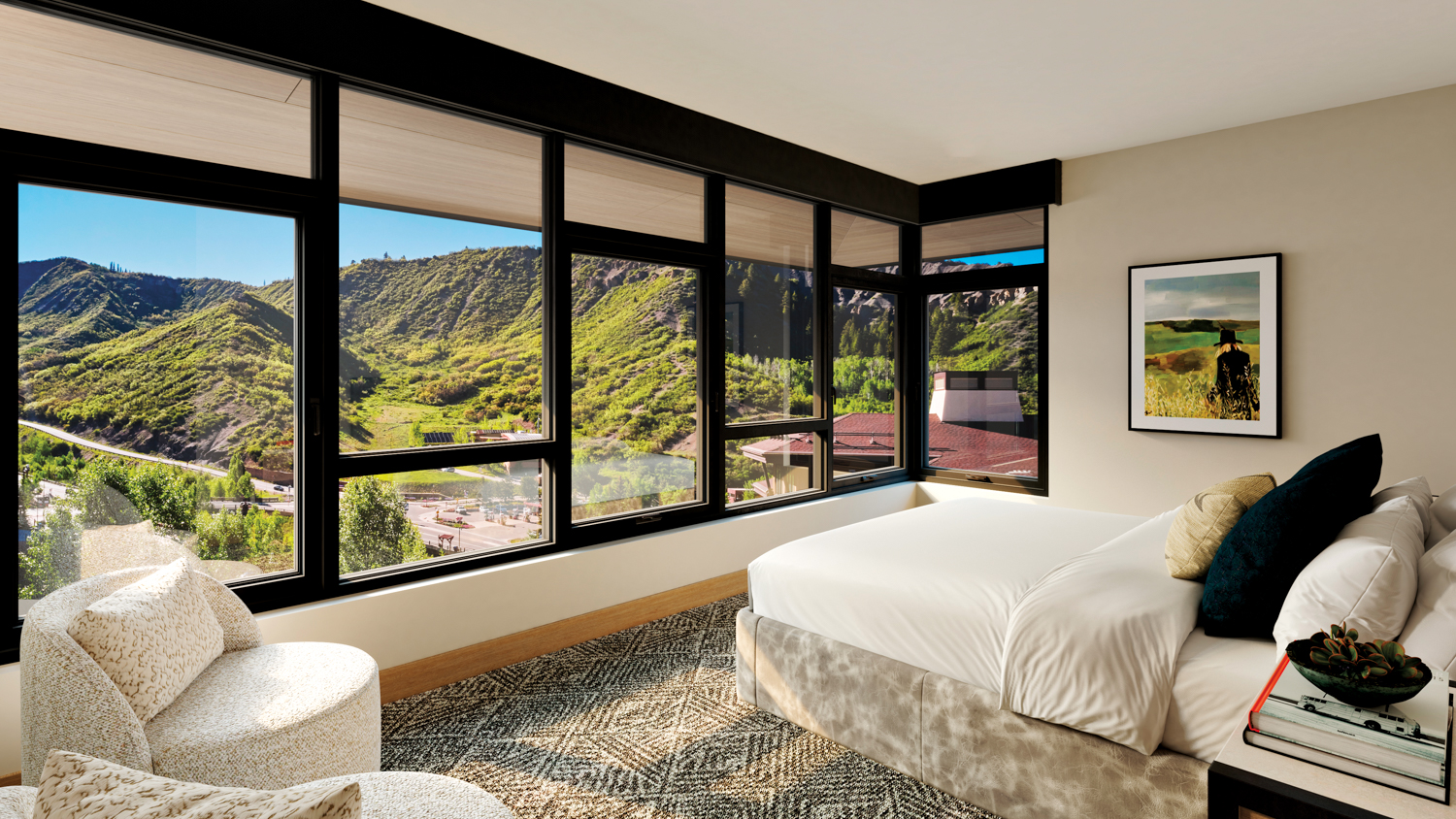 Cirque x Viceroy bedroom with mountain views seen through a window wall