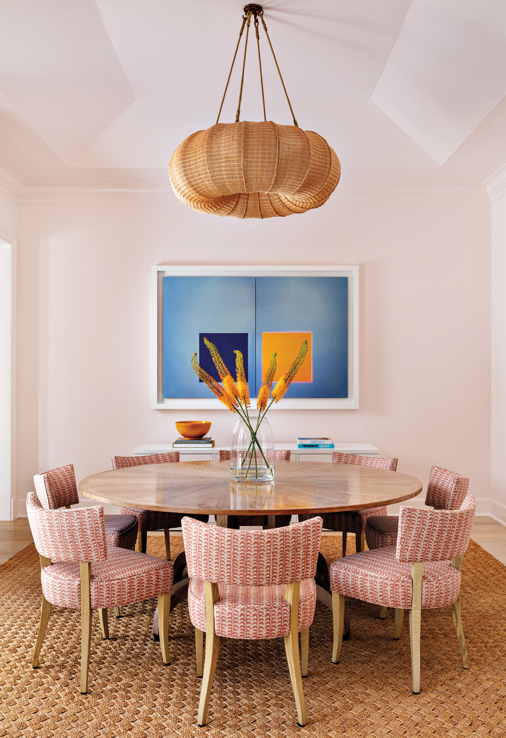 dining area with pink walls,...
