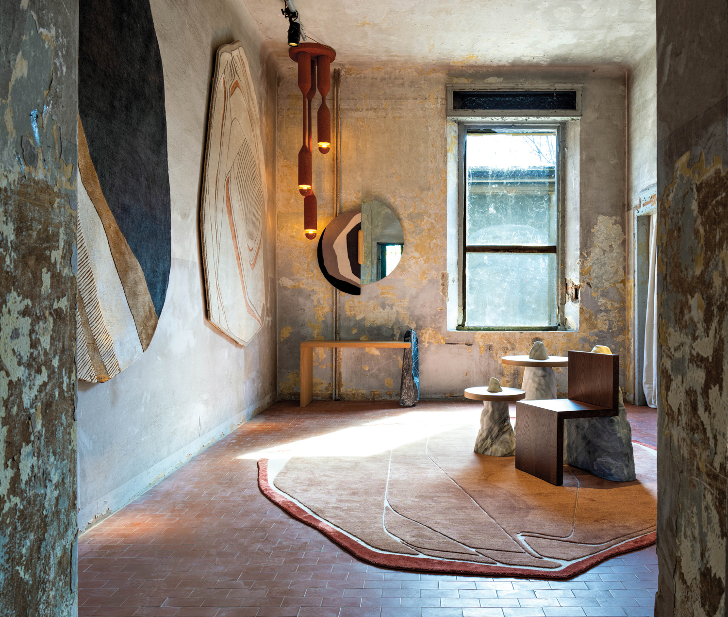Room with sculptural rugs by Samantha Gallacher and furniture pieces made from marble and wood