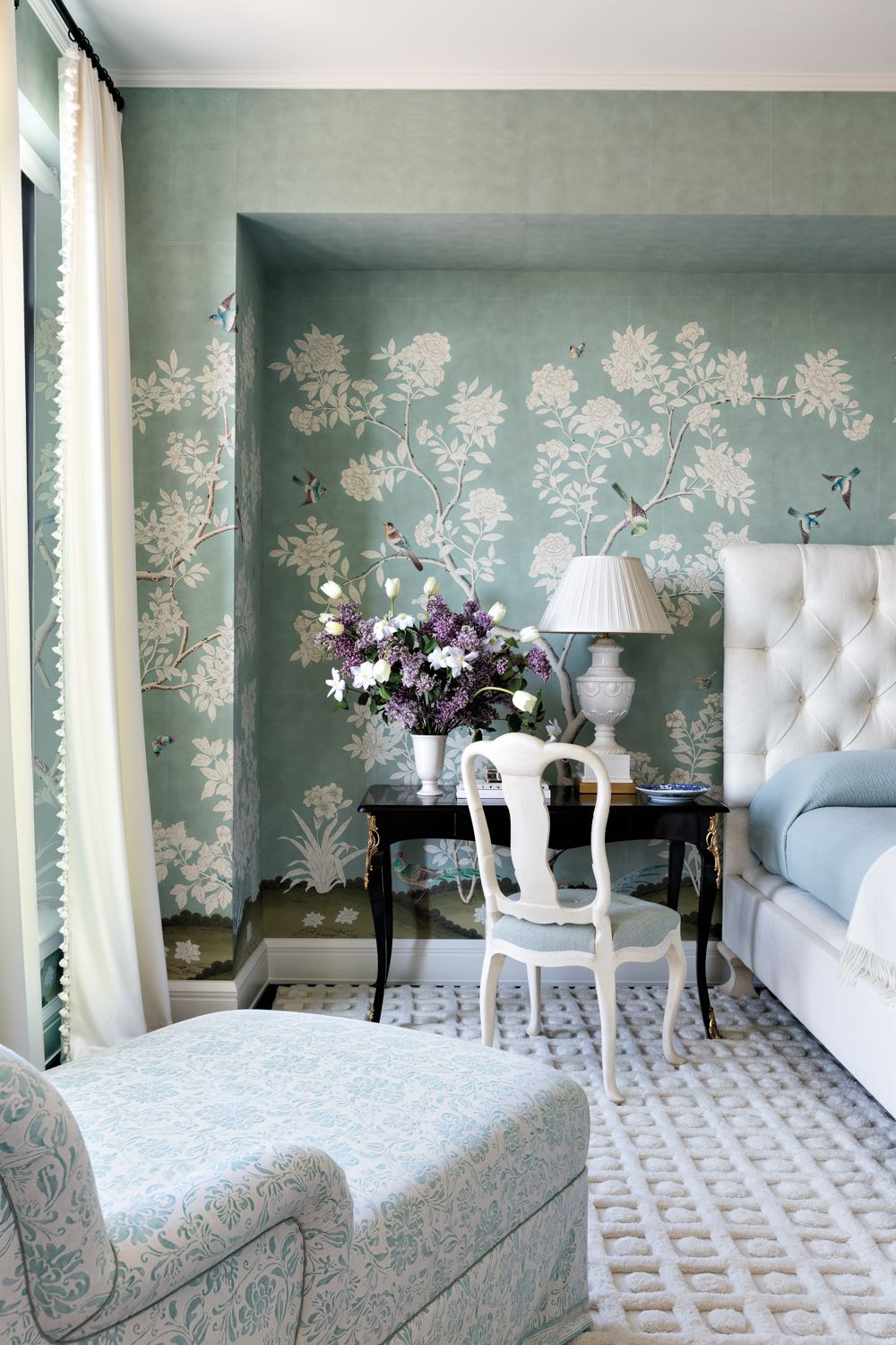 blue chinoiserie bedroom with a...