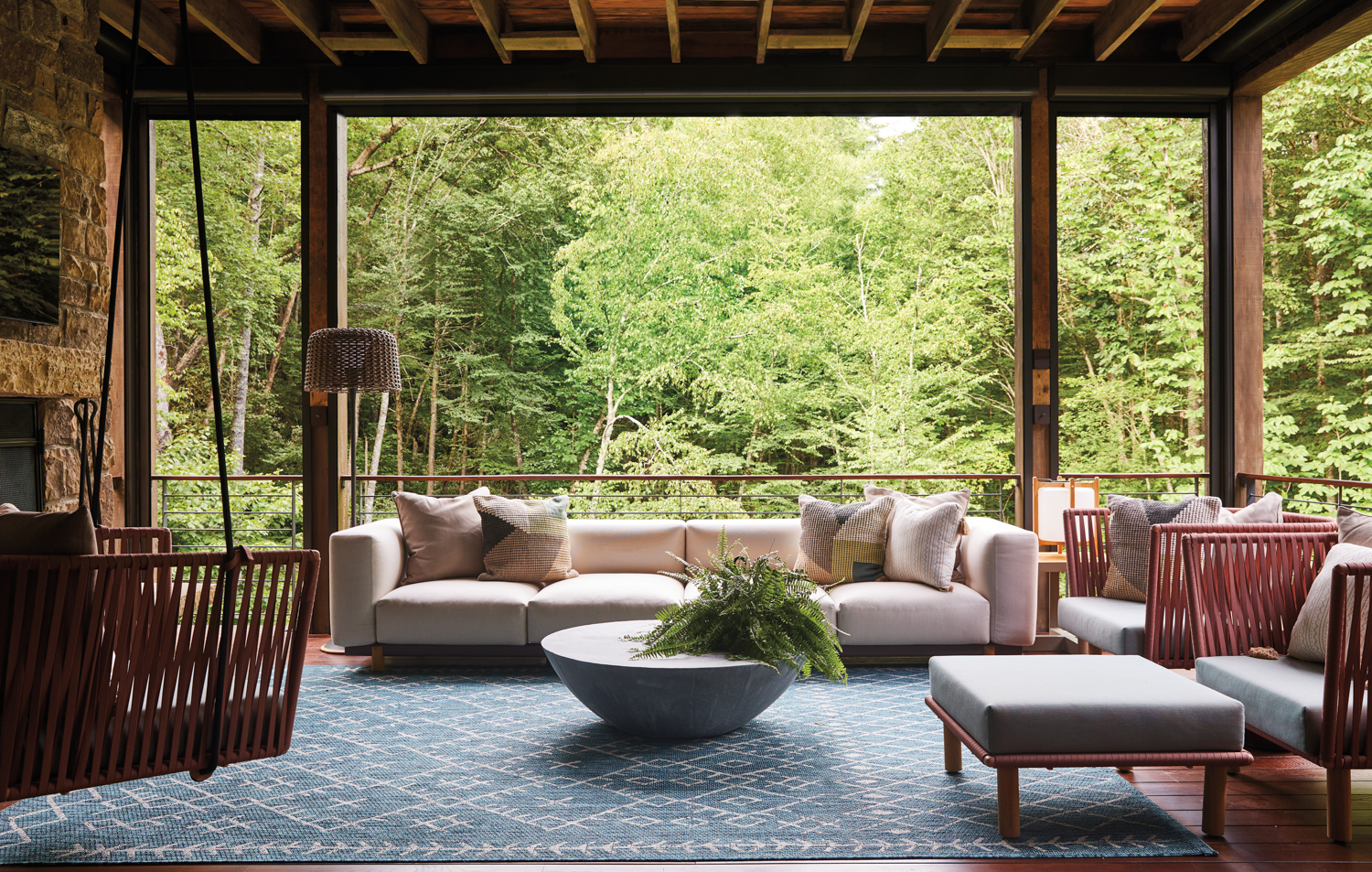 A rustic porch furnished with...