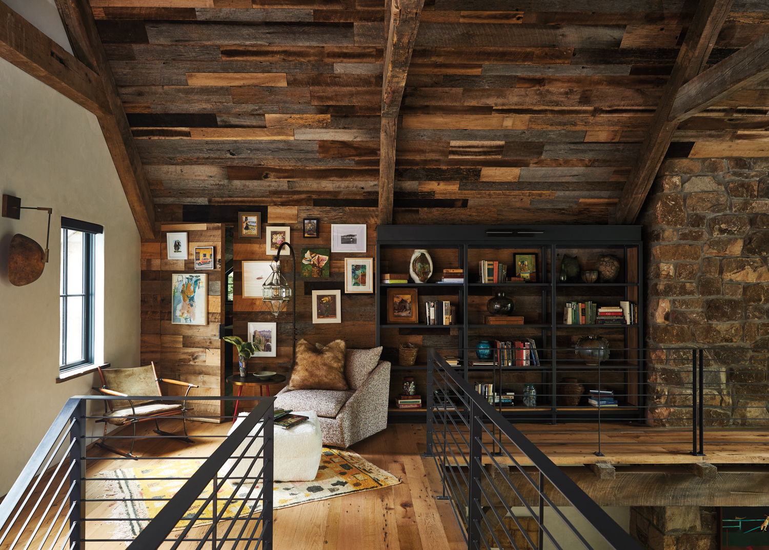 Upstairs landing with wooden walls,...