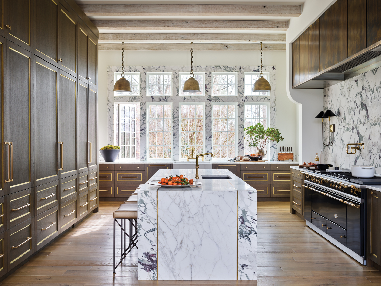 Kitchen featuring dramatic slabs of...