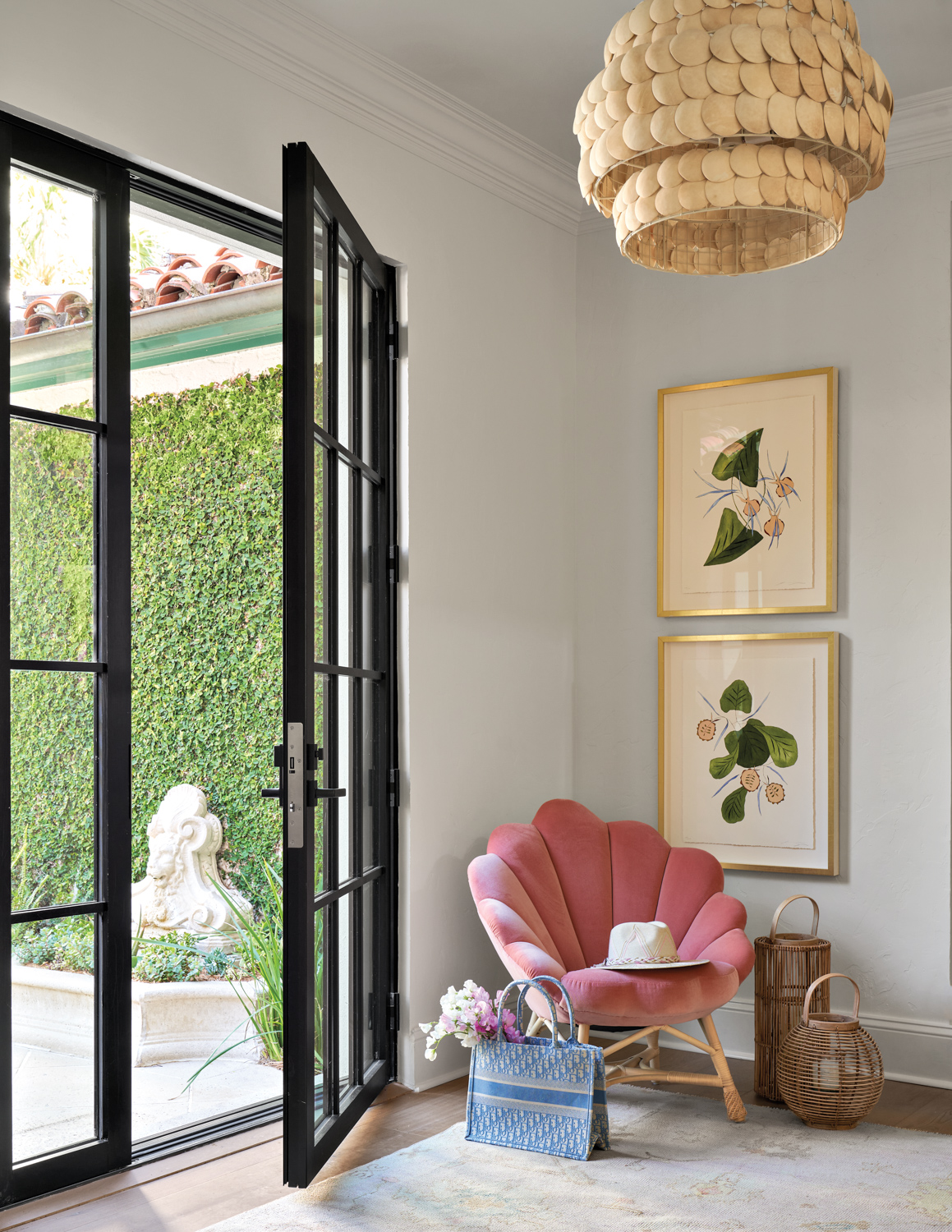 Entryway with black French doors...