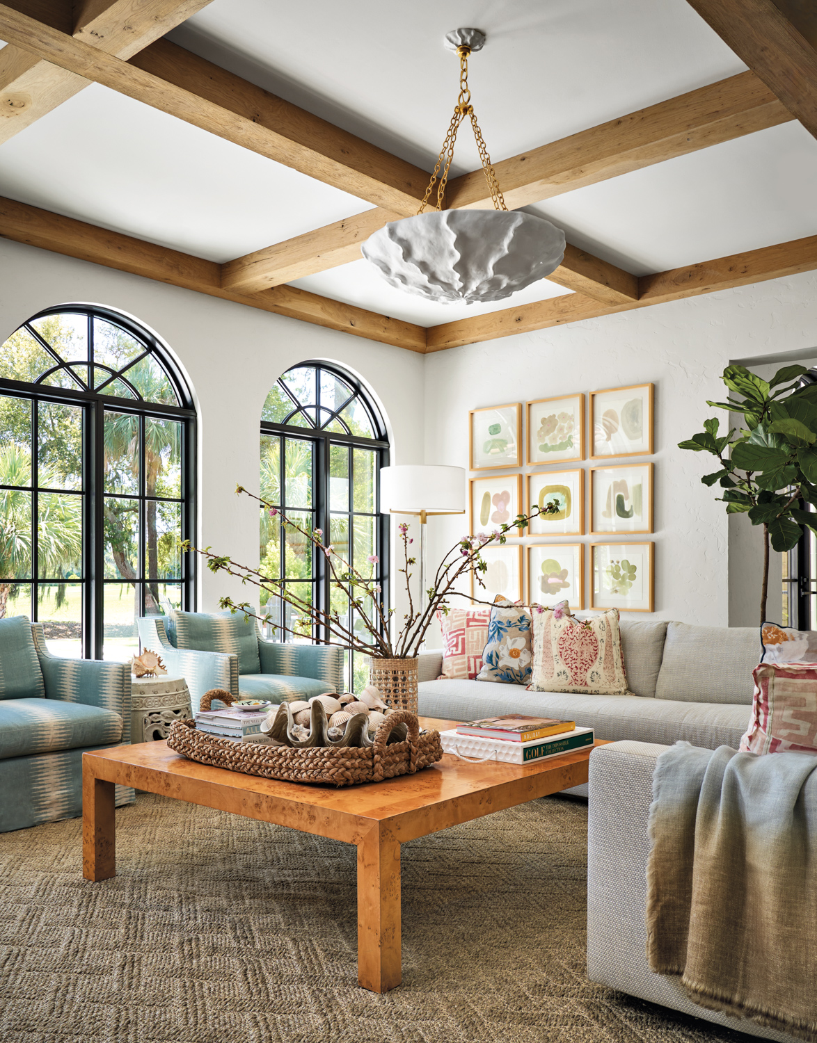 Living room with arched windows,...