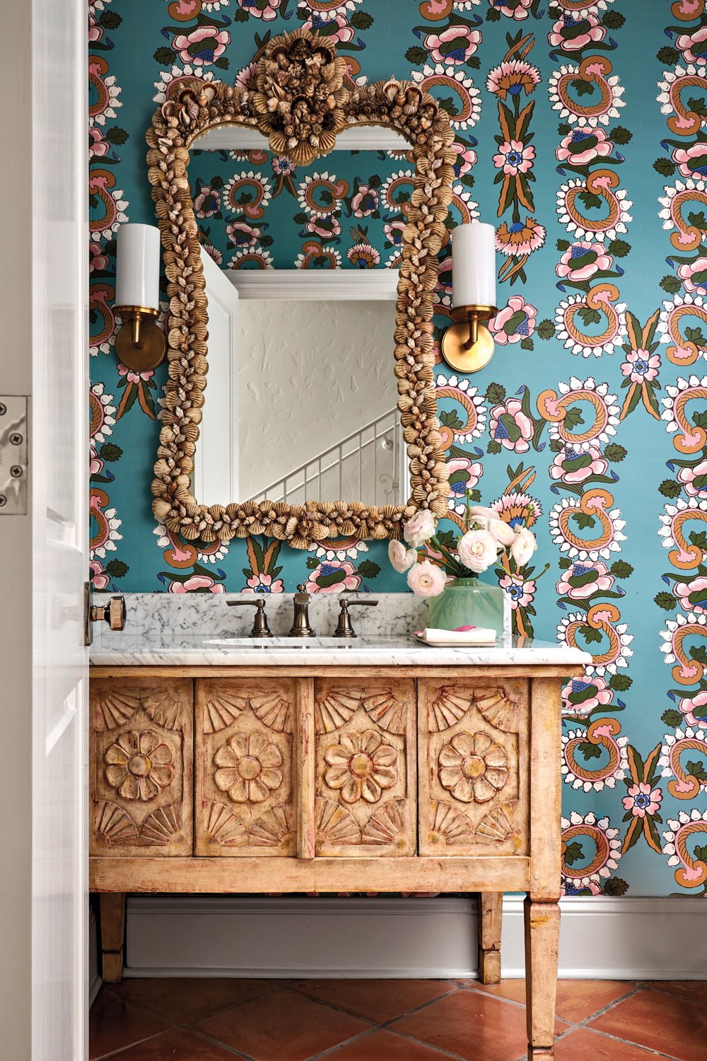 Powder room with patterned turquoise...