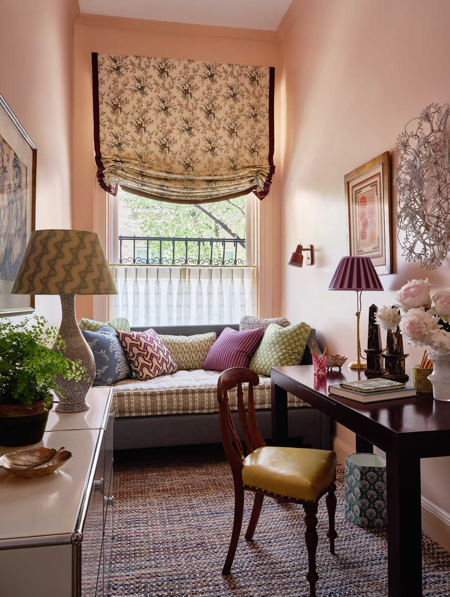 peach office with floral shades, lamps and daybed