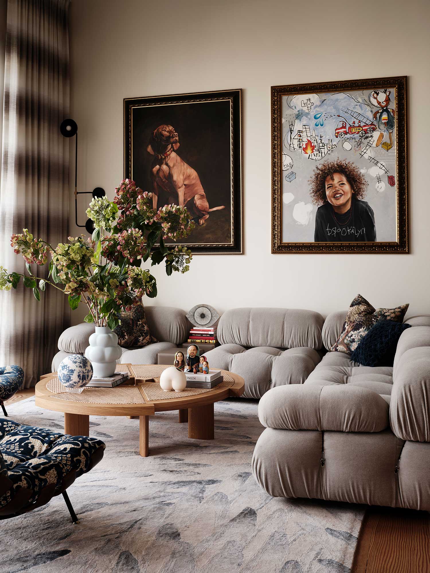 warm neutral gray living room with cloud couch and contemporary art
