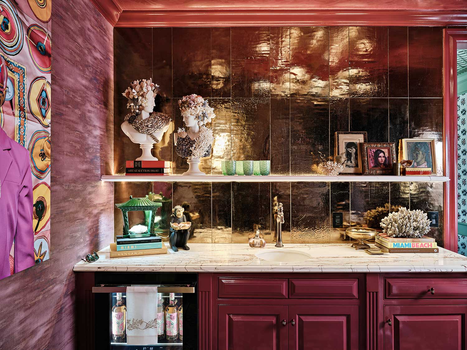 highly saturated bold berry bar at the kips bay show house with open shelves exemplifies trendy moody paint colors