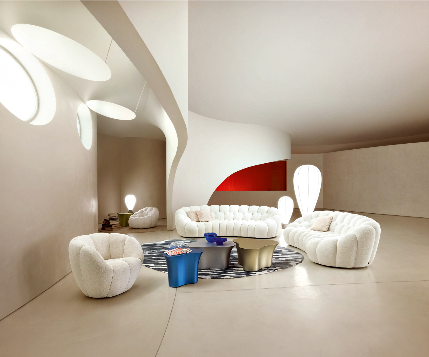 Roche Bobois’ white bubble sofa, loveseat and armchair create seating area in expansive white-toned space