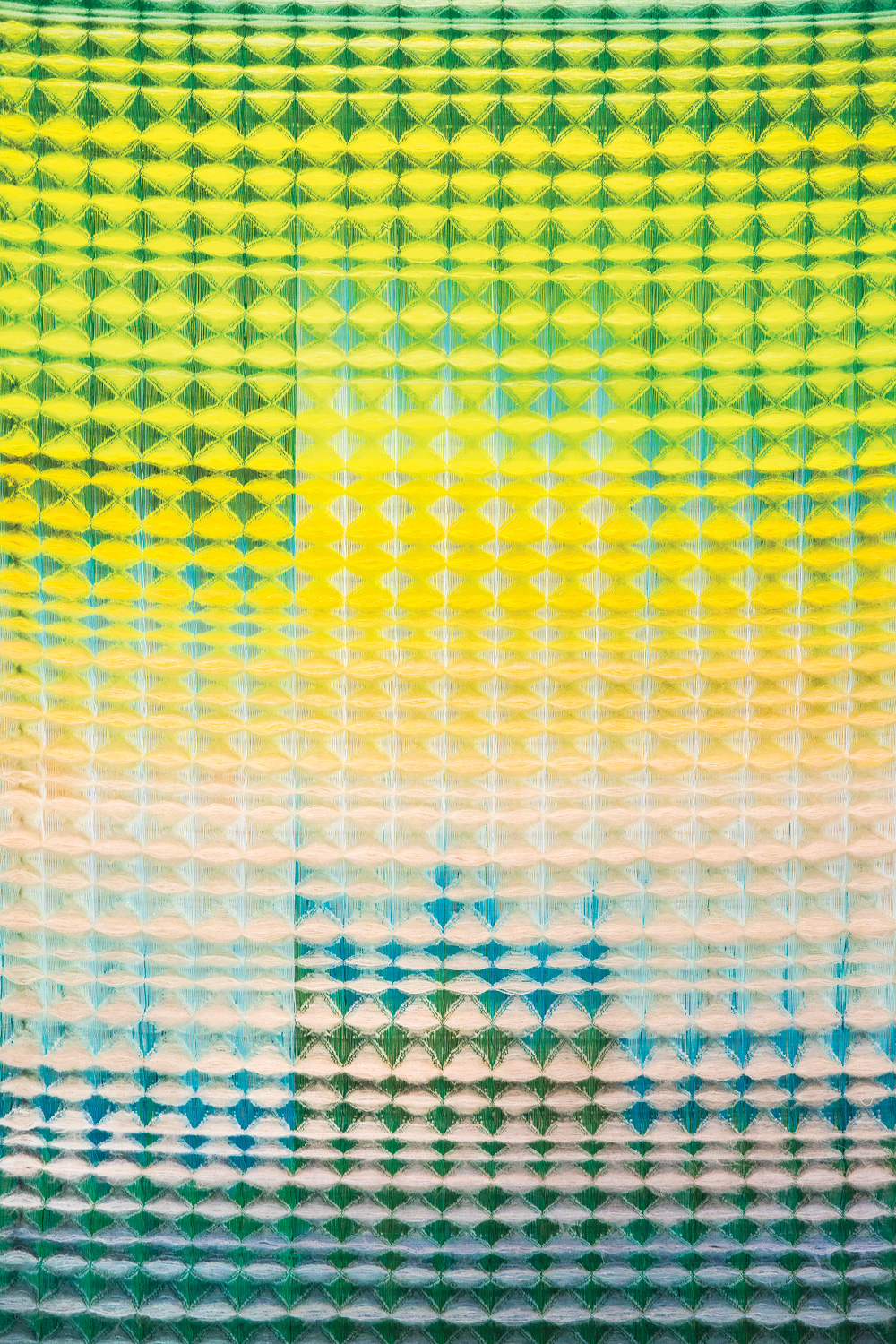 textile weaving in an ombre color palette