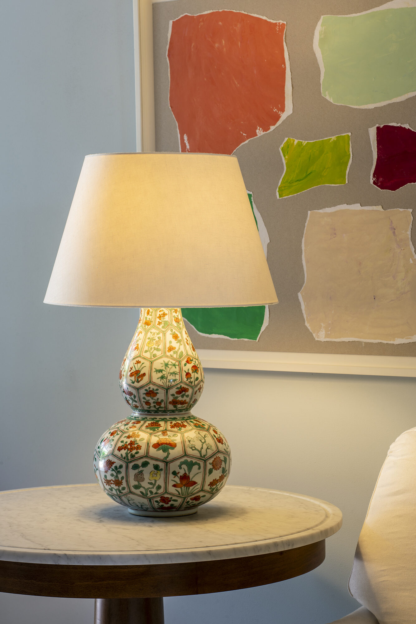 white lamp with a red floral and classic gourd shape base