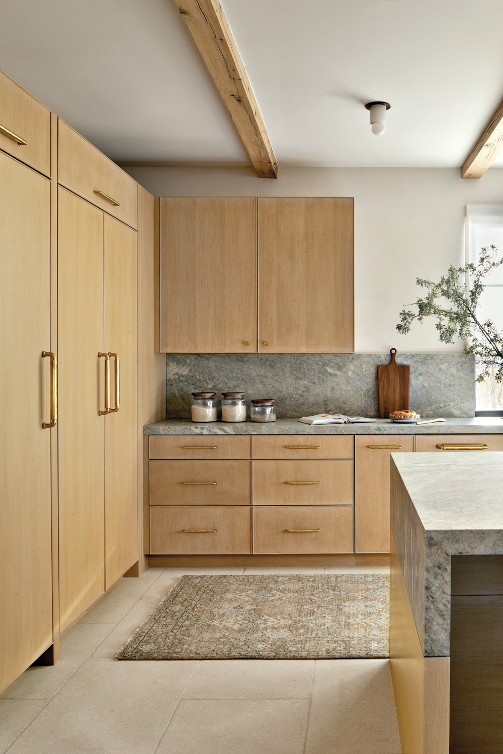 Kitchen with white oak cabinetry,...