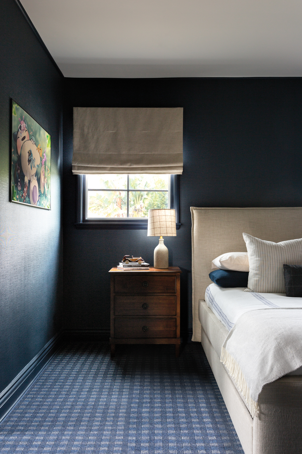 bedroom with dark blue walls,...