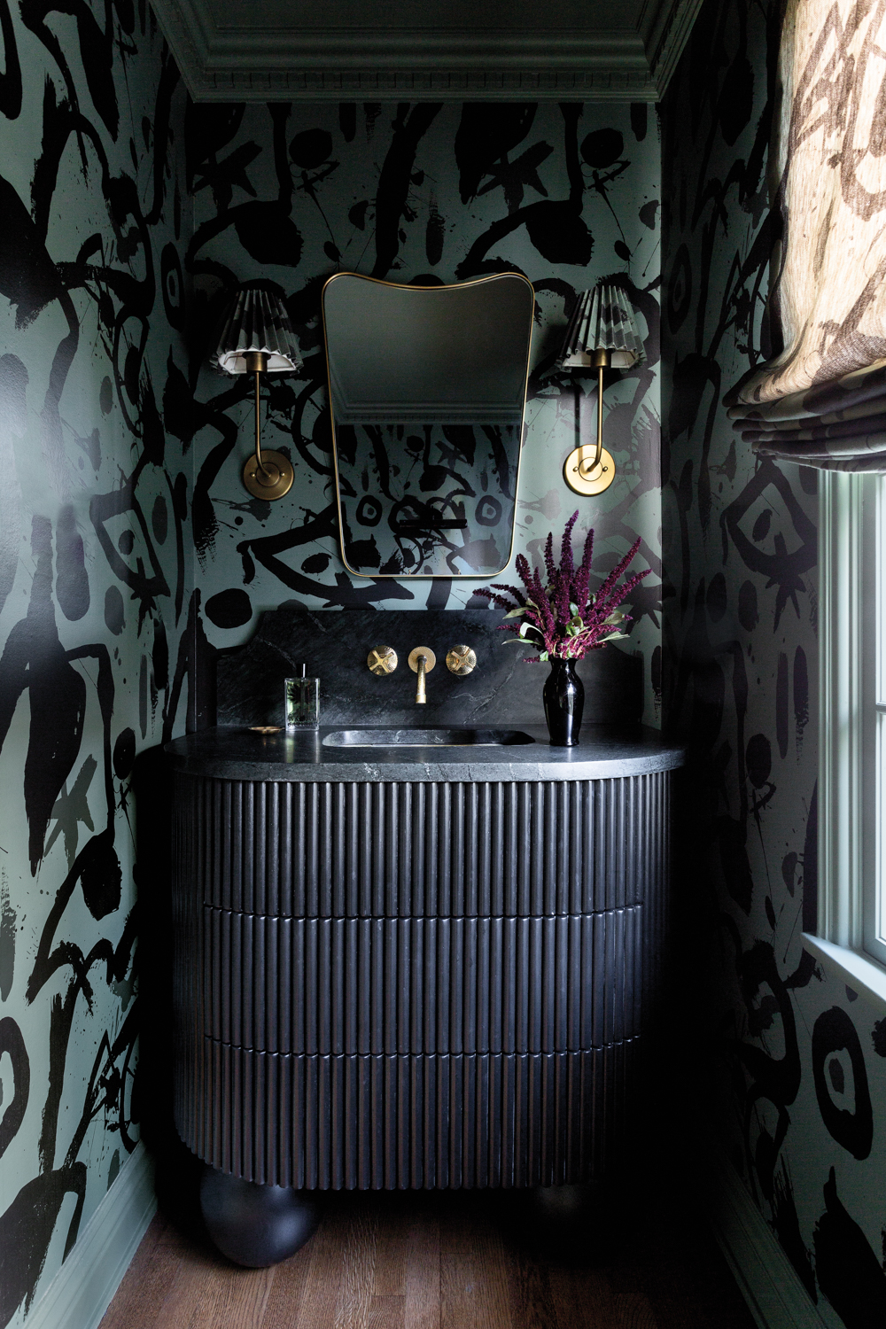 powder room with a black...