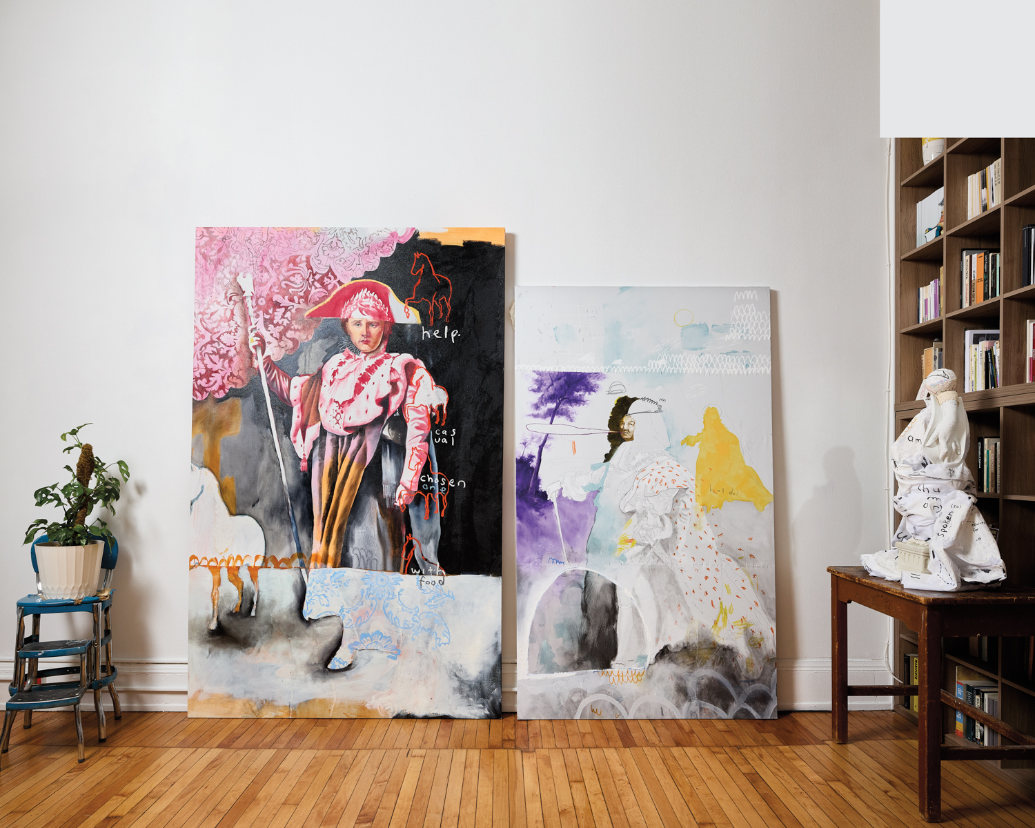 Two historically inspired oil paintings leaning against a wall
