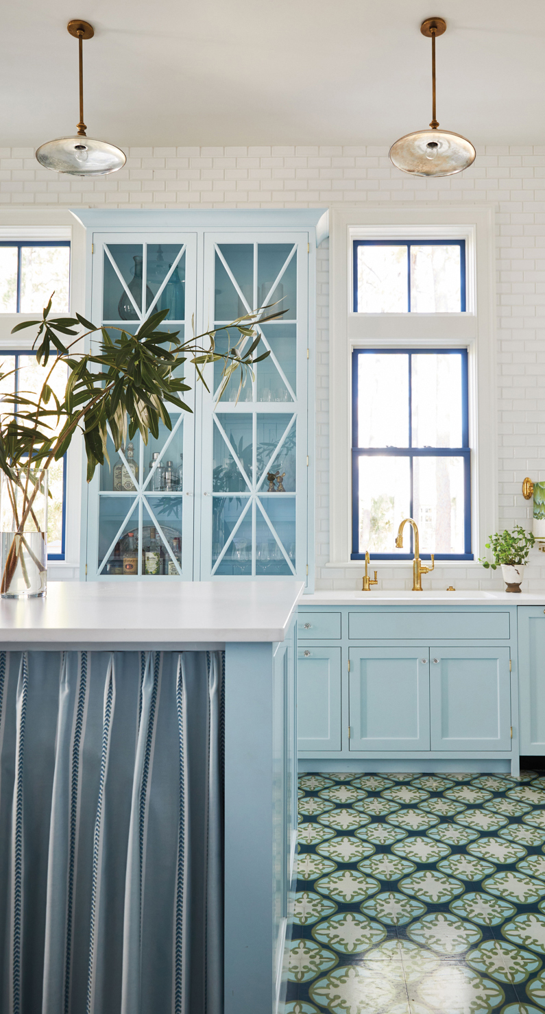 kitchen with light blue cabinets and island by Elizabeth Reynolds