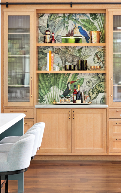 kitchen with brown oak bar area with jungle wallpaper