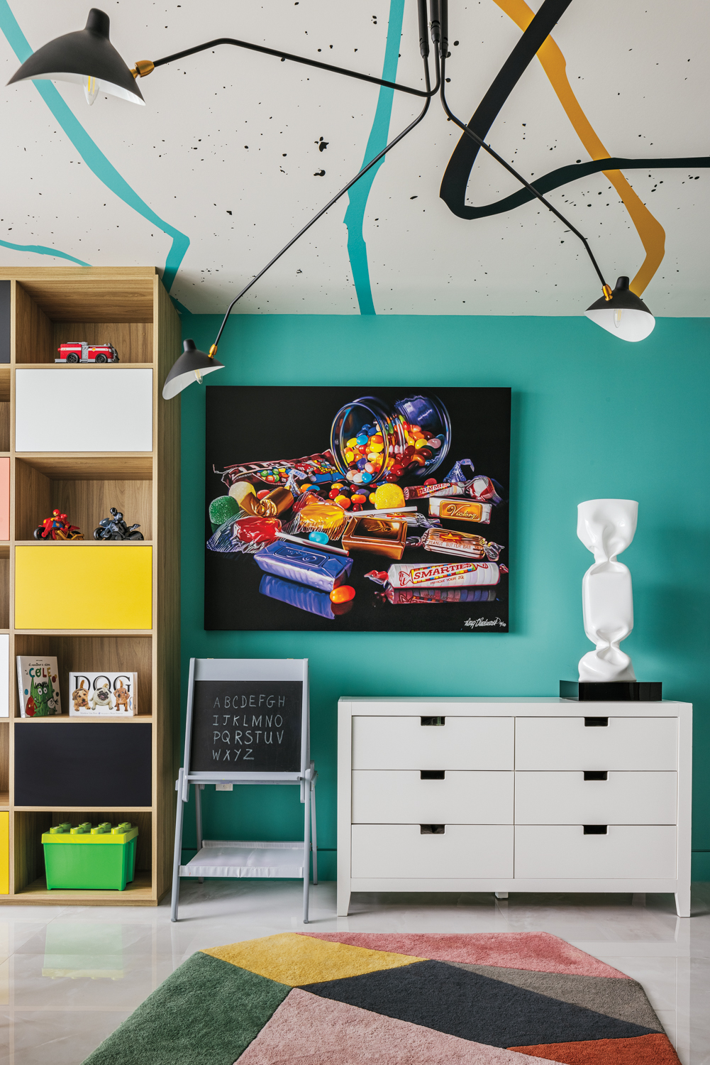 playroom with teal wall, candy...