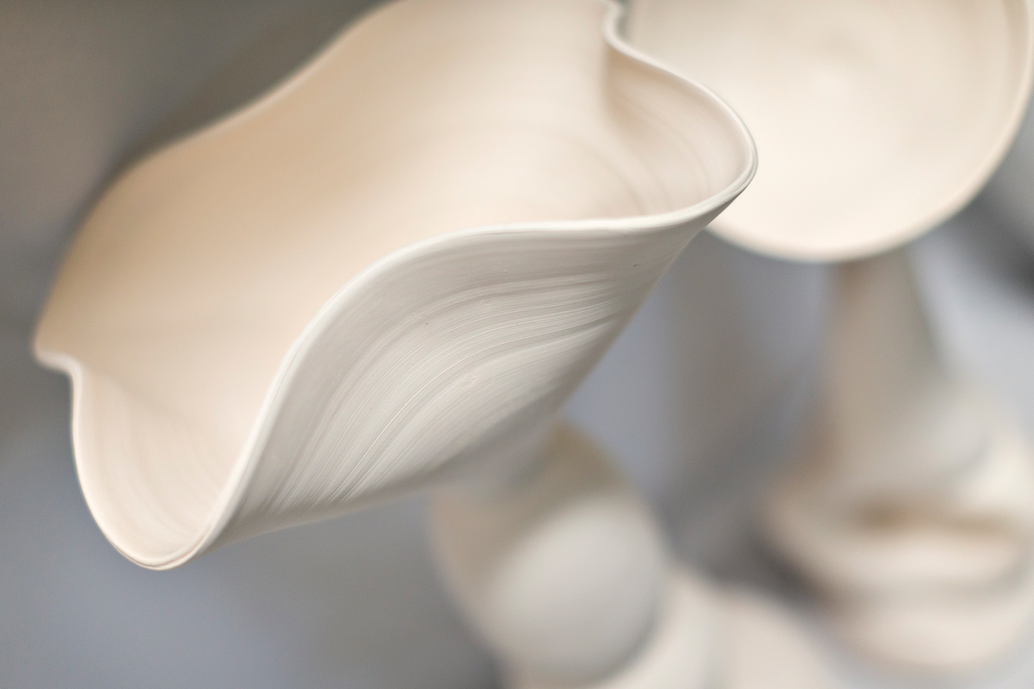 a close-up of one of palombo's minimalist white sculptures