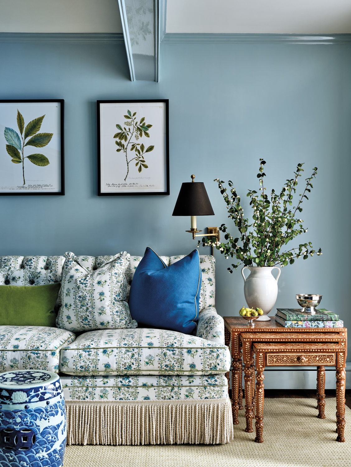 Blue living room with botanical...