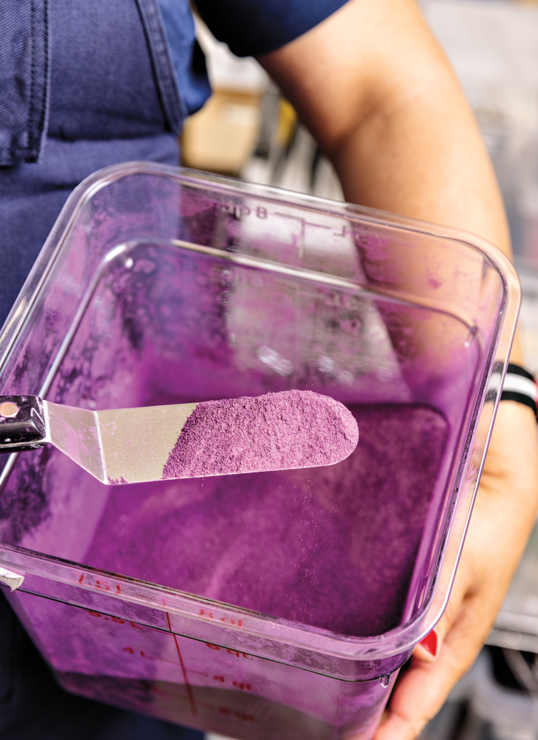 A container of purple pigment.