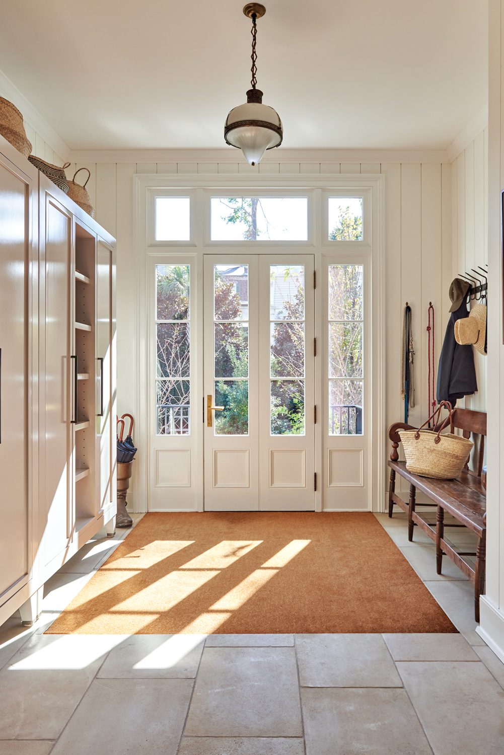 Classic mudroom entry with simplistic...