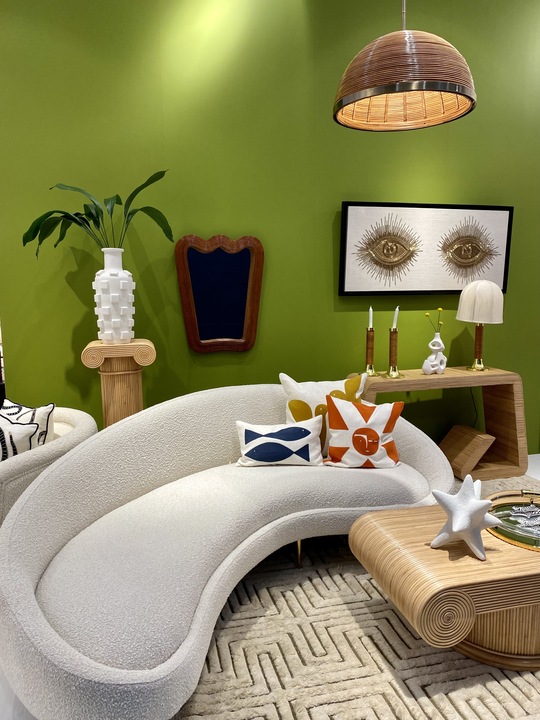 green room with curved white sofa and brown rectangular table from Maison&Objet 2023