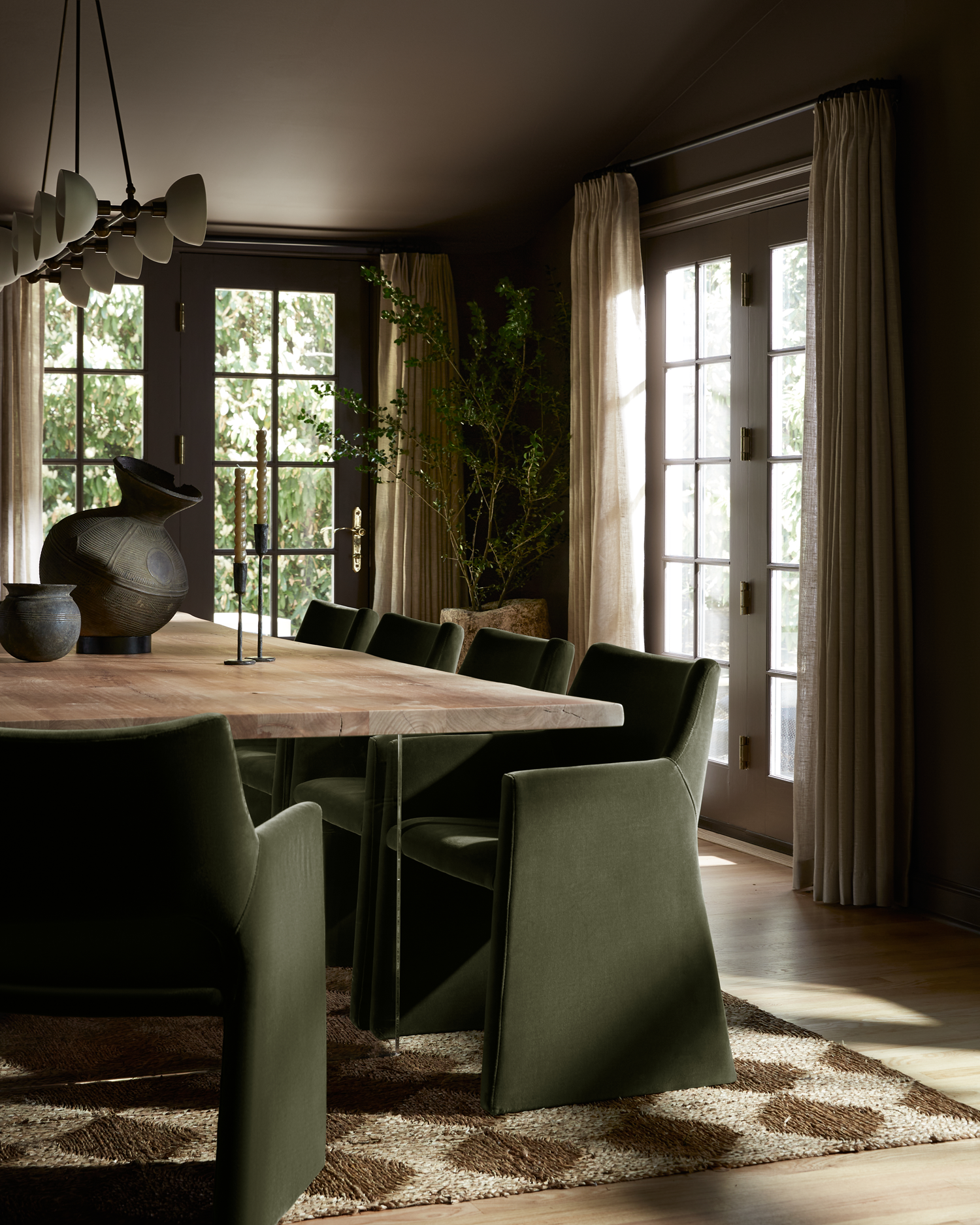 brown dining room with olive green chairs