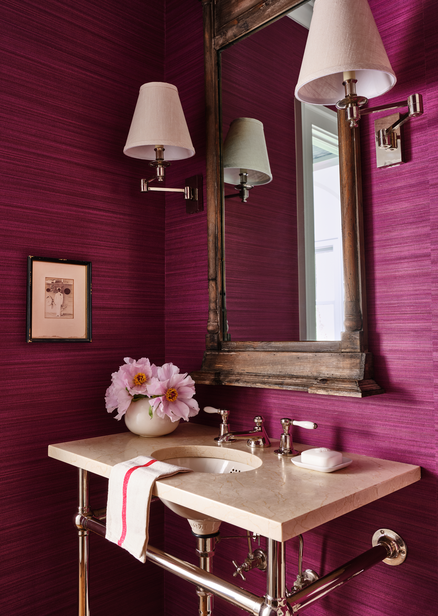 fuschia powder room with wooden mirror and white sink as one of many 2024 paint color trends