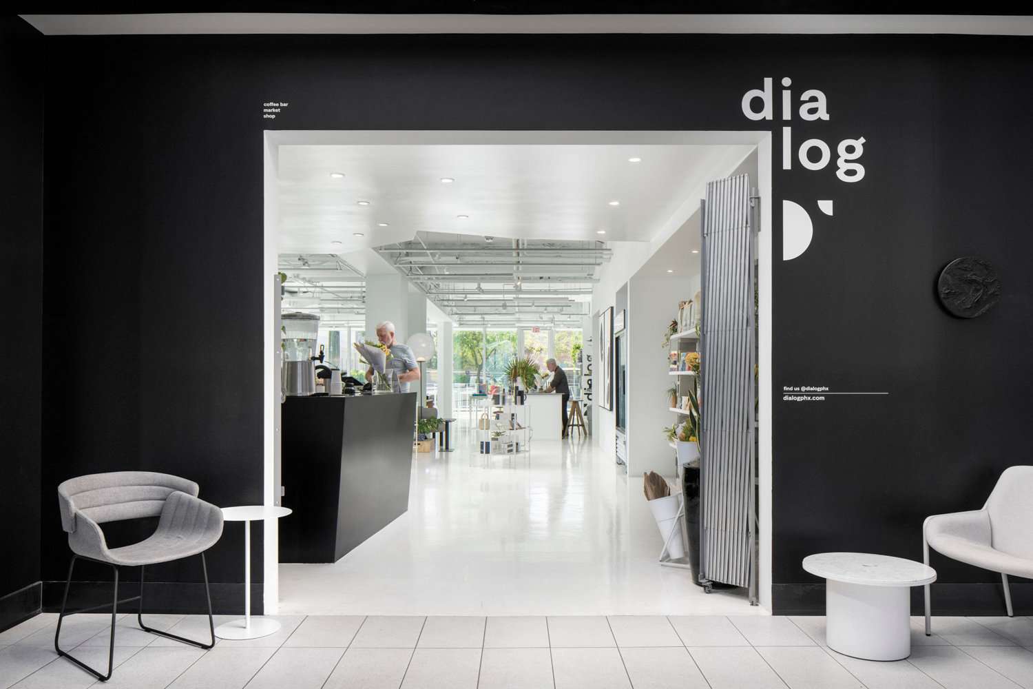 Entrance to dialog shop, featuring black-and-white design scheme.
